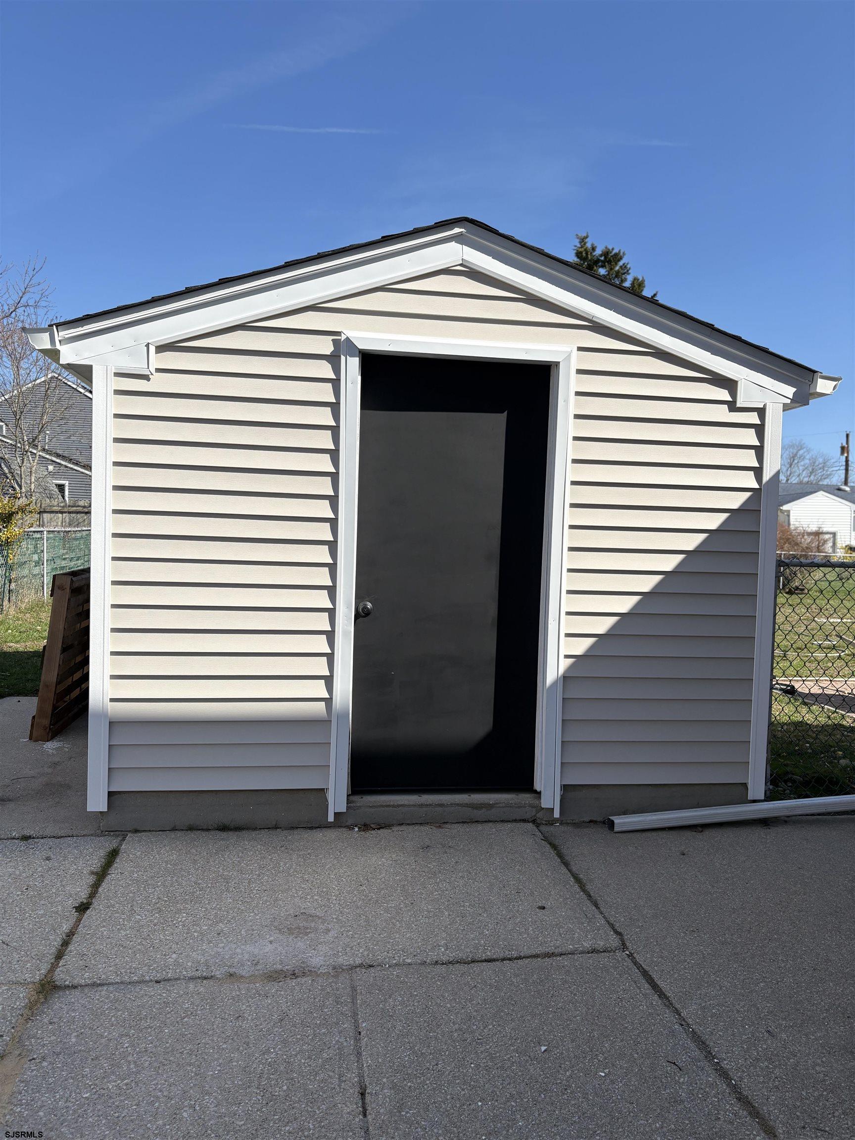 31 Gulph Mill Road Somers Point, NJ 08244 - Photo 28 of 32 a view of a house with garage