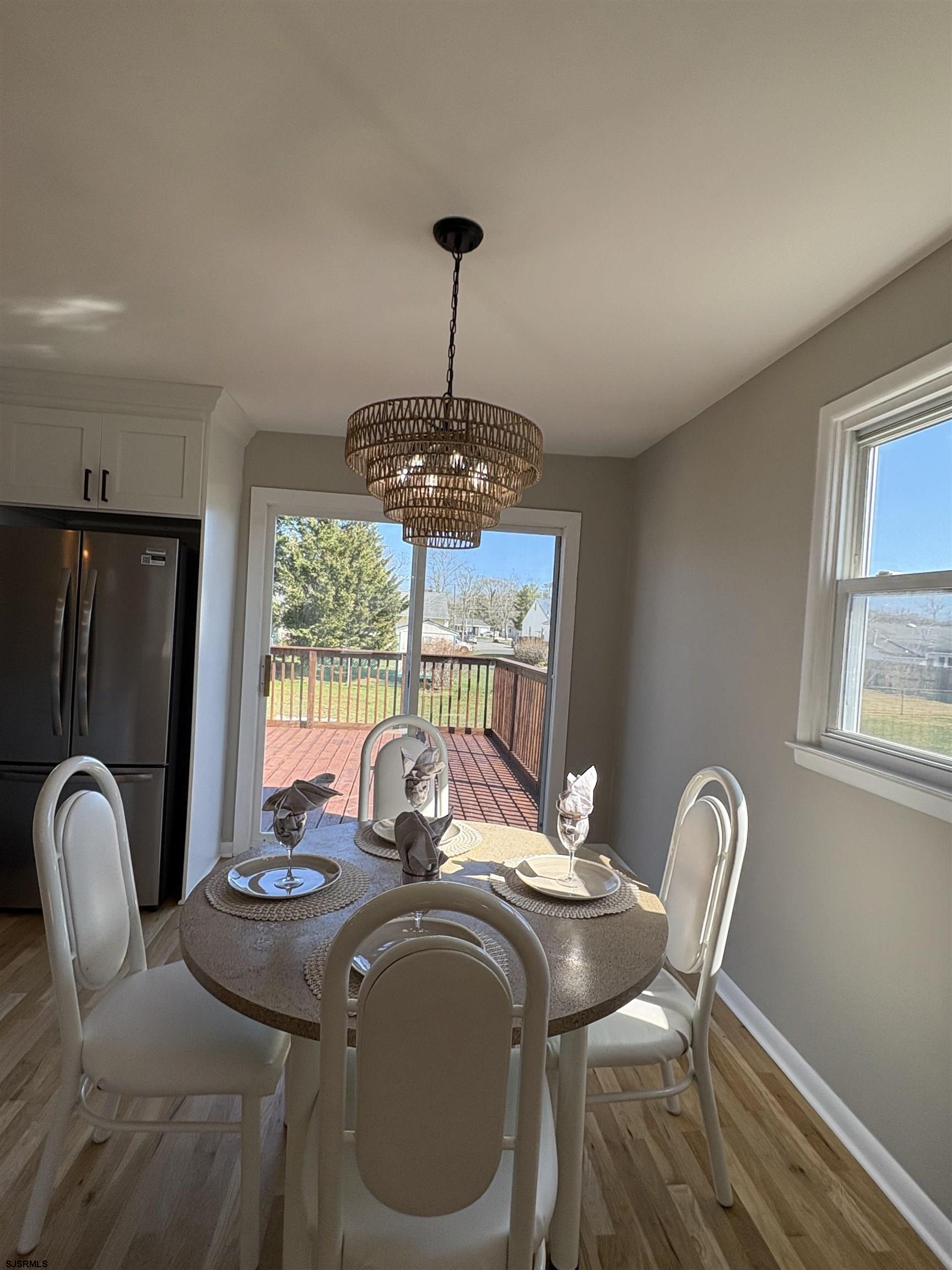 31 Gulph Mill Road Somers Point, NJ 08244 - Photo 3 of 32 a dining room with furniture a chandelier and window