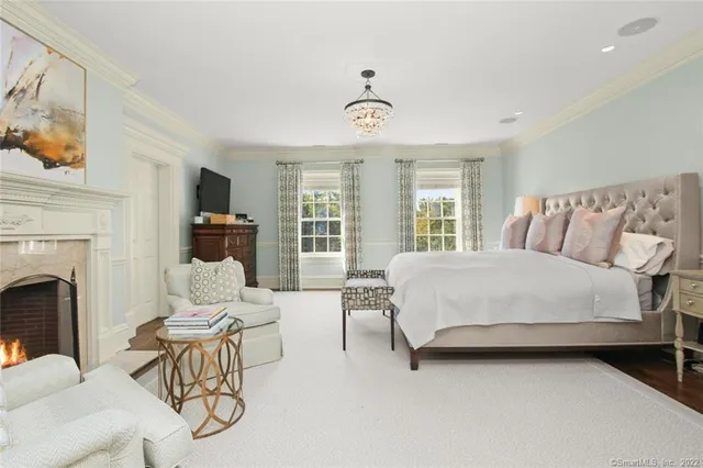 a spacious bedroom with a bed and a couch