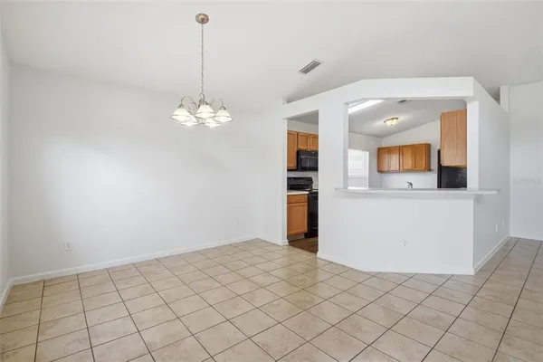 a kitchen with a refrigerator stove and microwave