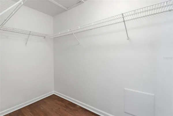 a bathroom with a sink a tub and a mirror