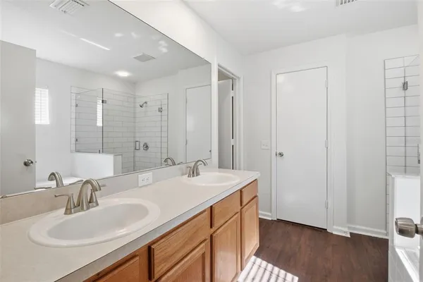 a bathroom with a bathtub and shower