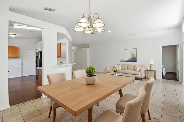 a kitchen with a table and chairs in it