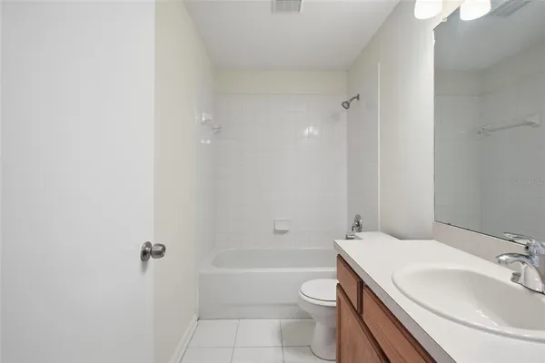 a bathroom with a sink a toilet and a bathtub