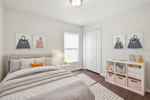 a bedroom with a bed and a cabinets