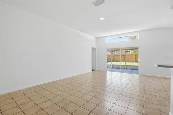 a view of a big room with windows and cabinet