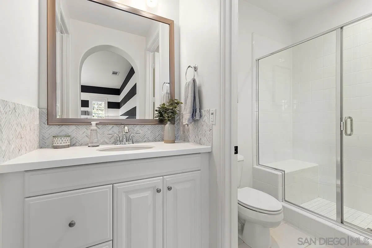 15457 Tanner Ridge Circle San Diego, CA 92127 - Photo 34 of 42 a bathroom with a toilet sink and mirror