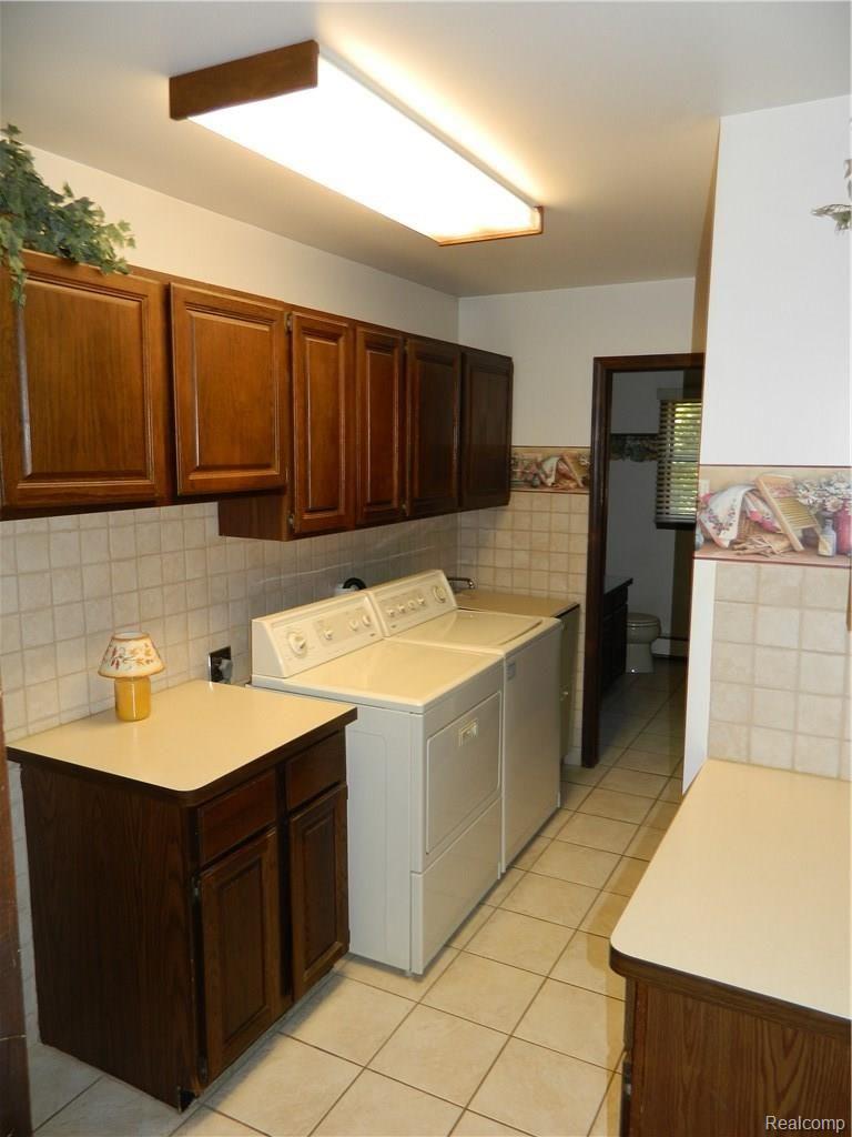 23113 Currie Road South Lyon, MI 48178 - Photo 32 of 49 1st floor laundry
