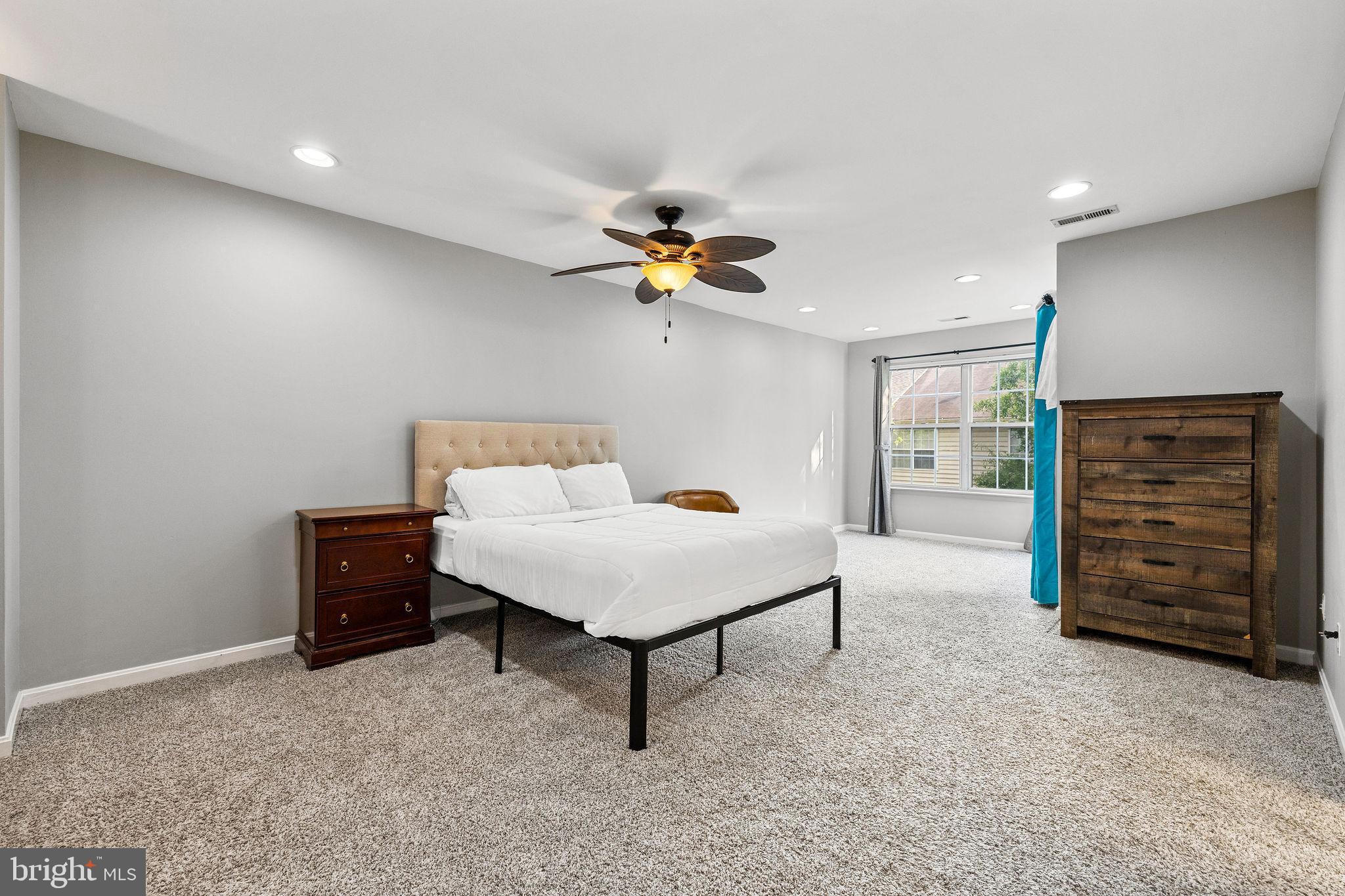 13503 Bannacker Place Herndon, VA 20171 - Photo 26 of 61 a living room with furniture and a ceiling fan