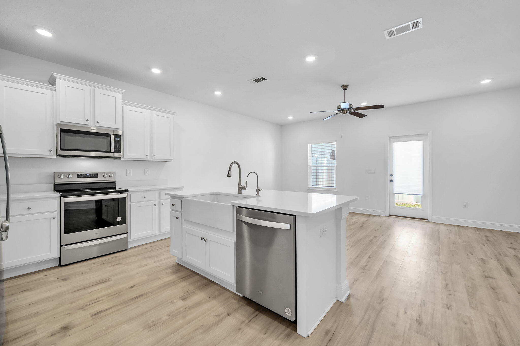22 Redbird Loop Destin, FL 32541 - Photo 10 of 40 a kitchen with a sink a stove and cabinets