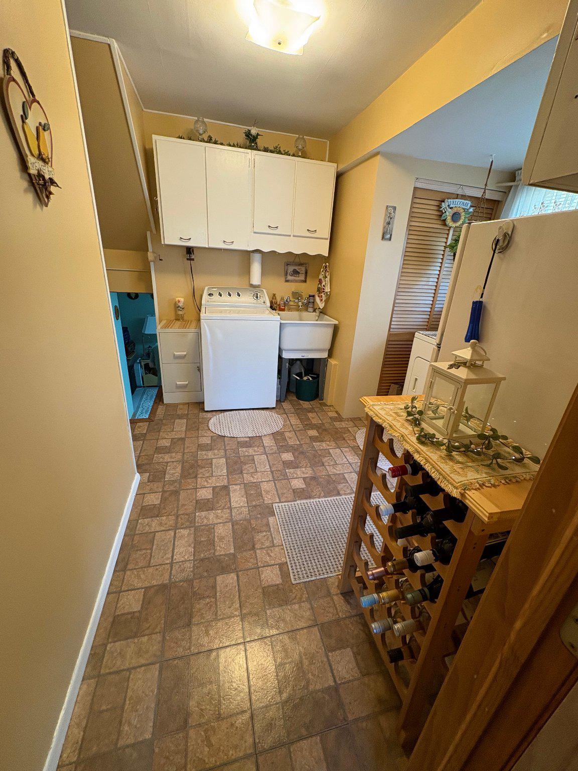 1045 Foster Street Philadelphia, PA 19116 - Photo 11 of 27 a kitchen with a stove and a refrigerator