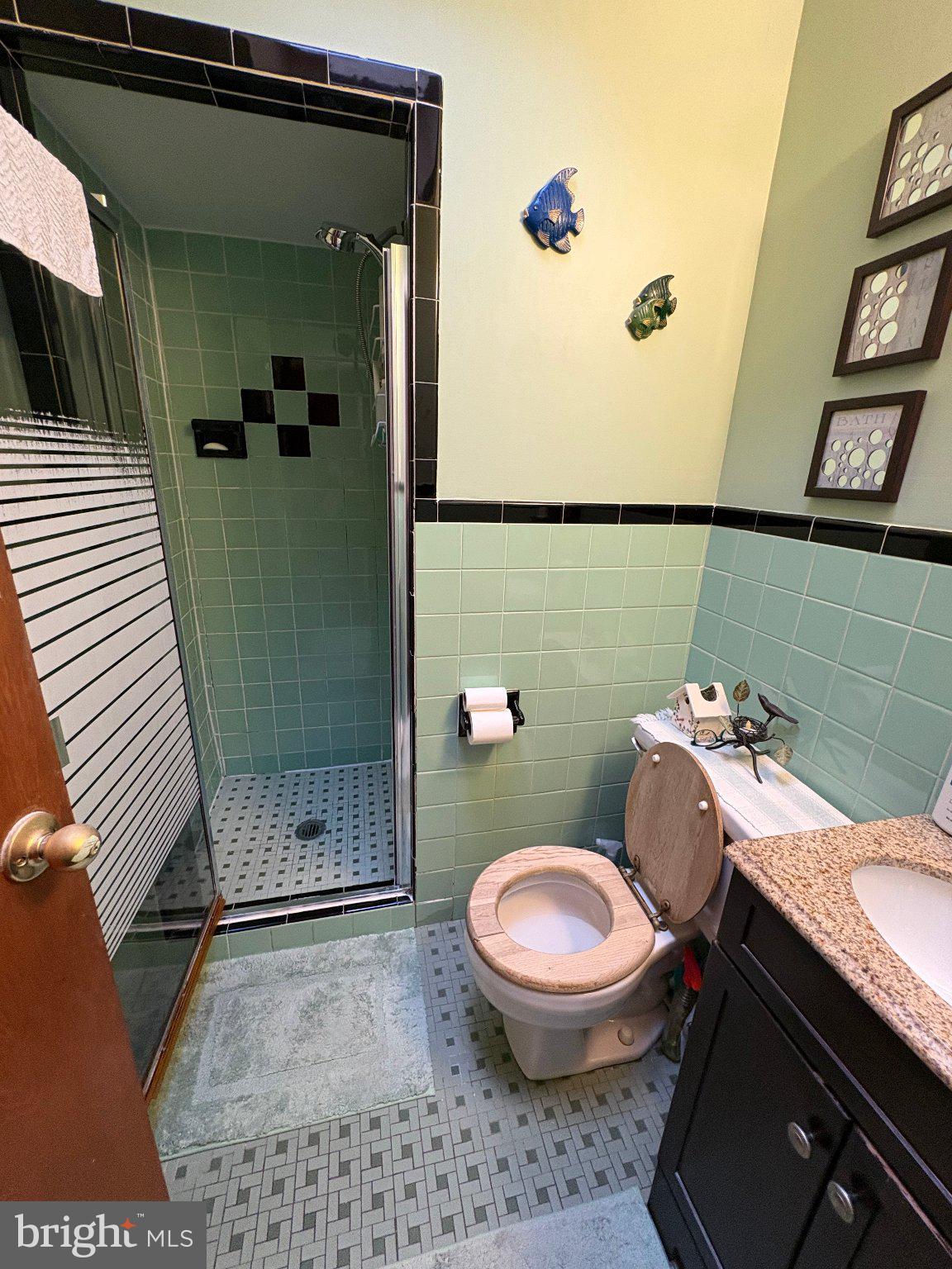 1045 Foster Street Philadelphia, PA 19116 - Photo 17 of 27 a bathroom with a sink a toilet and shower