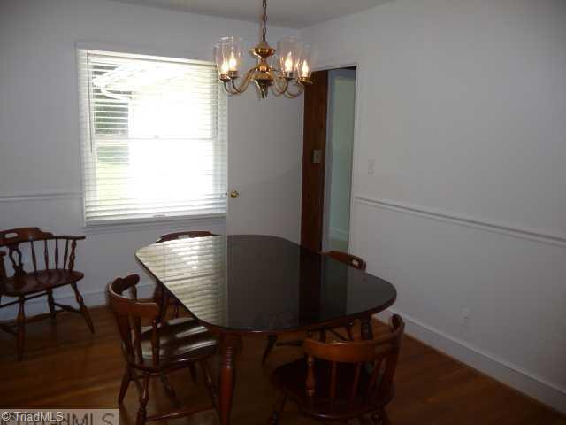 1236 Pinebluff Road Winston-Salem, NC 27103 - Photo 5 of 12 Dining Room. Dining room with beautiful Hardwood flooring and chair rail