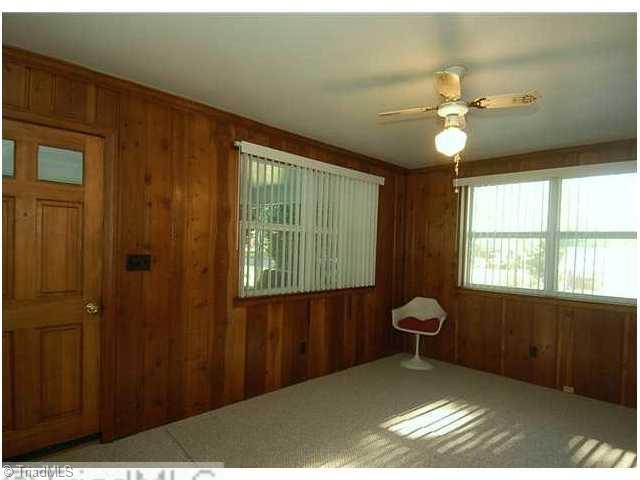 1236 Pinebluff Road Winston-Salem, NC 27103 - Photo 7 of 12 Sunroom. Sunroom w/ built-in shelves and closet can also be used as an office or a den.