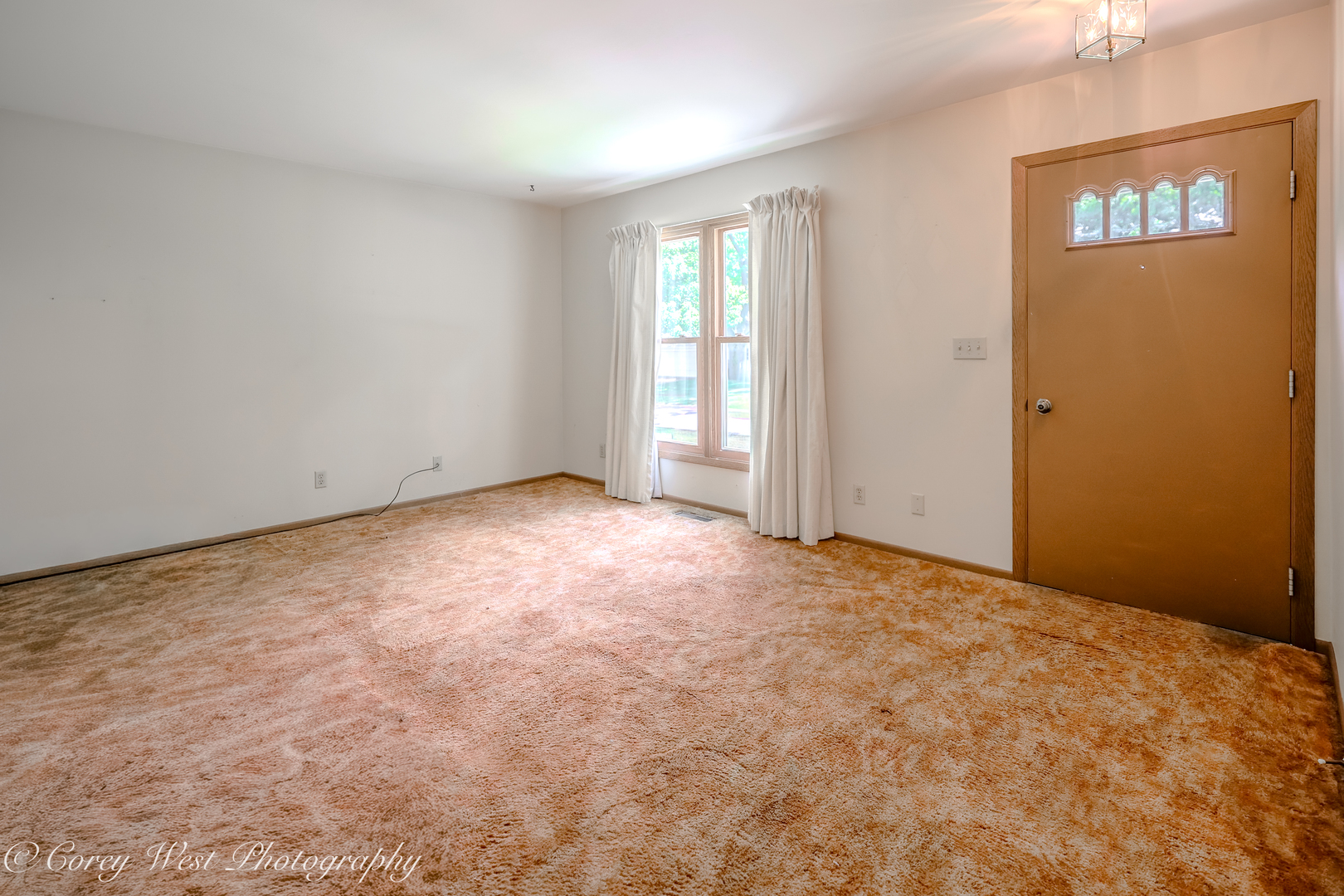 335 South Hadsall Street Genoa, IL 60135 - Photo 5 of 23 an empty room with windows