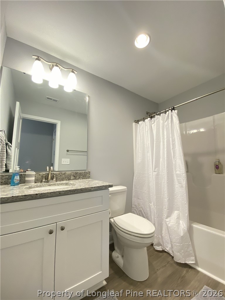 900 Allstar Avenue Cameron, NC 28326 - Photo 11 of 17 a bathroom with a toilet a sink and a bathtub