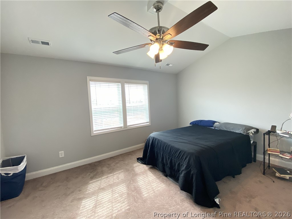 900 Allstar Avenue Cameron, NC 28326 - Photo 14 of 17 a bedroom with a bed and window