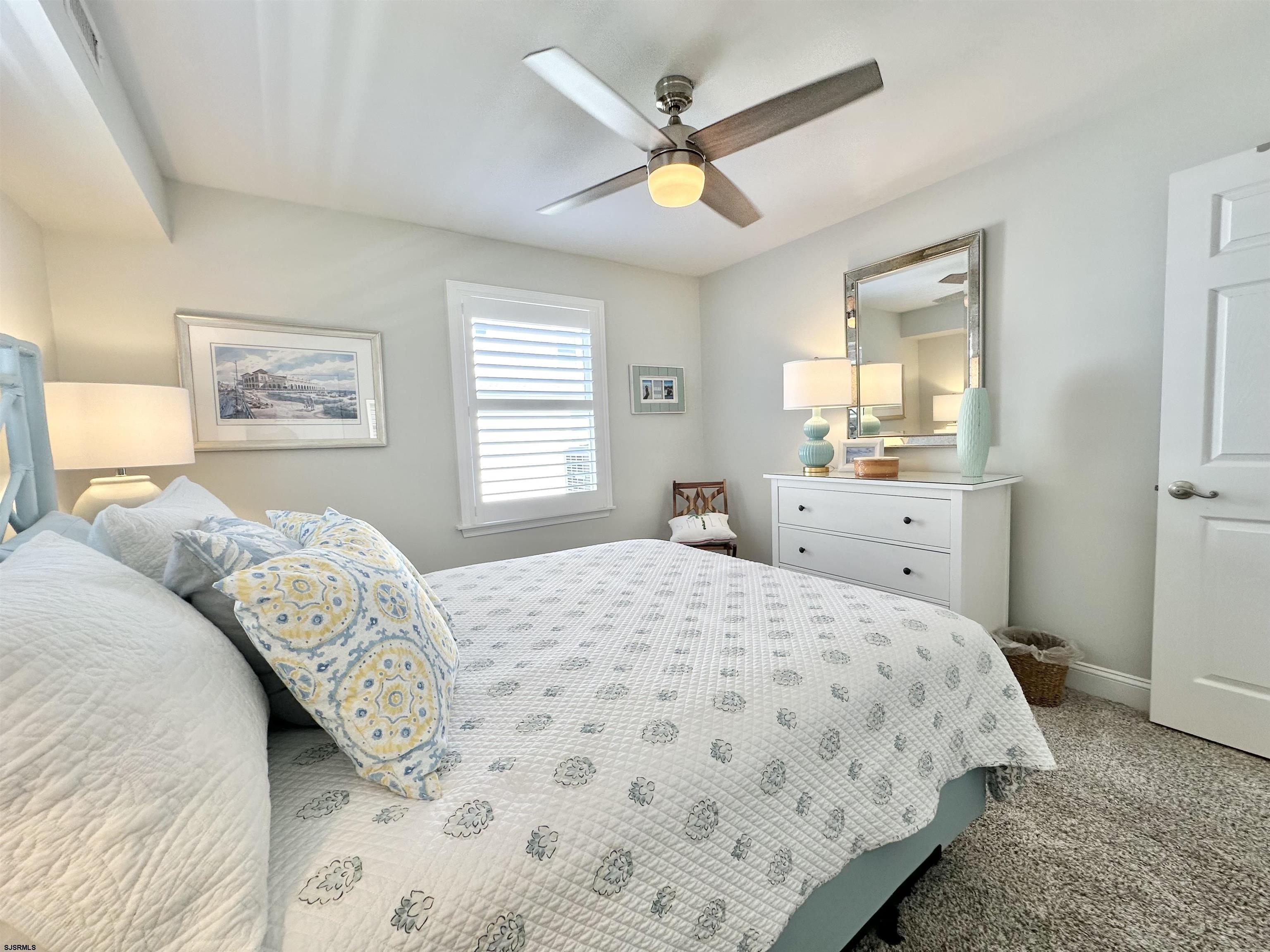 337 12th Street South Brigantine, NJ 08203 - Photo 15 of 36 a bedroom with a large bed and a window