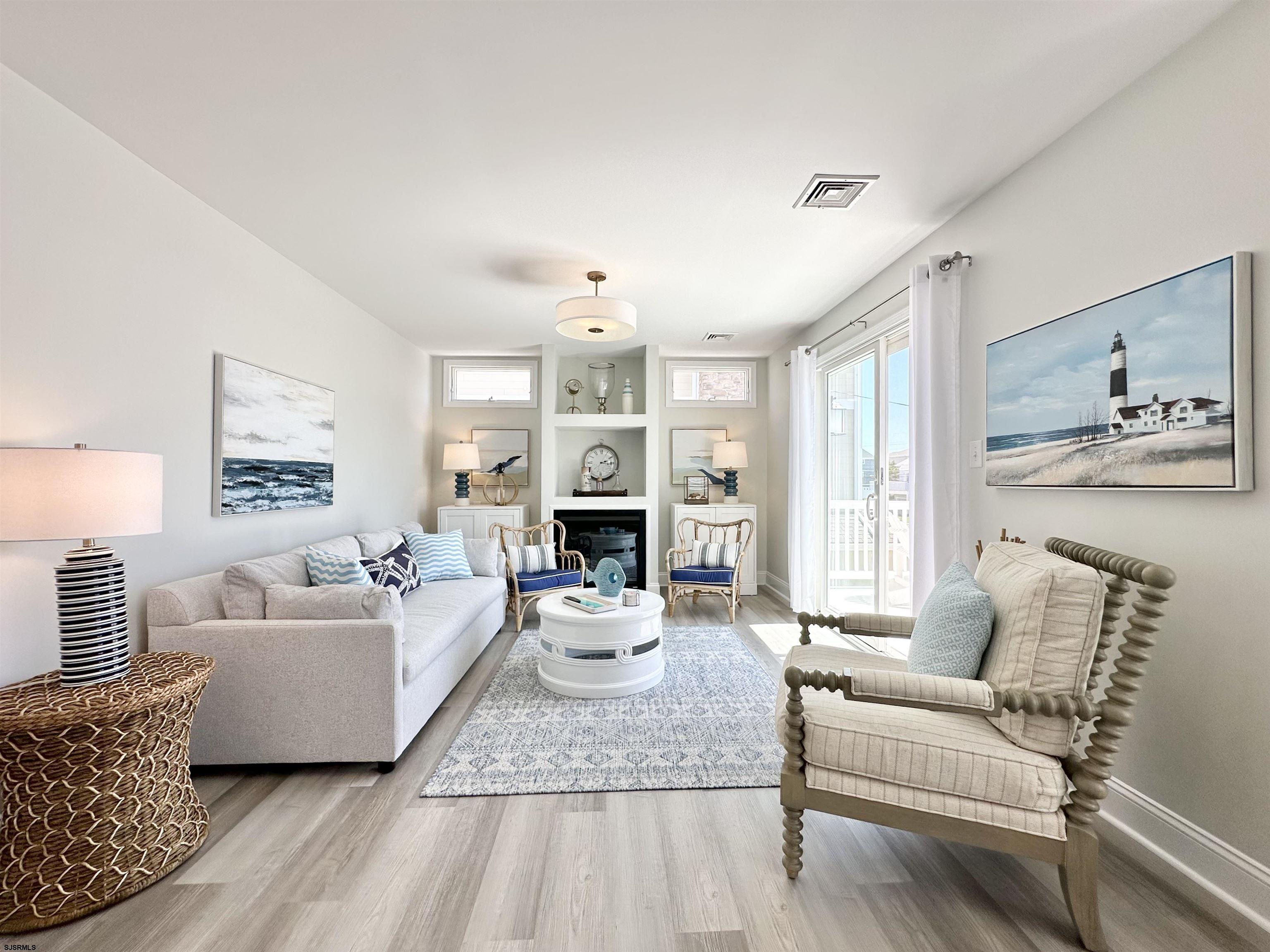337 12th Street South Brigantine, NJ 08203 - Photo 16 of 36 a living room with furniture and a large window