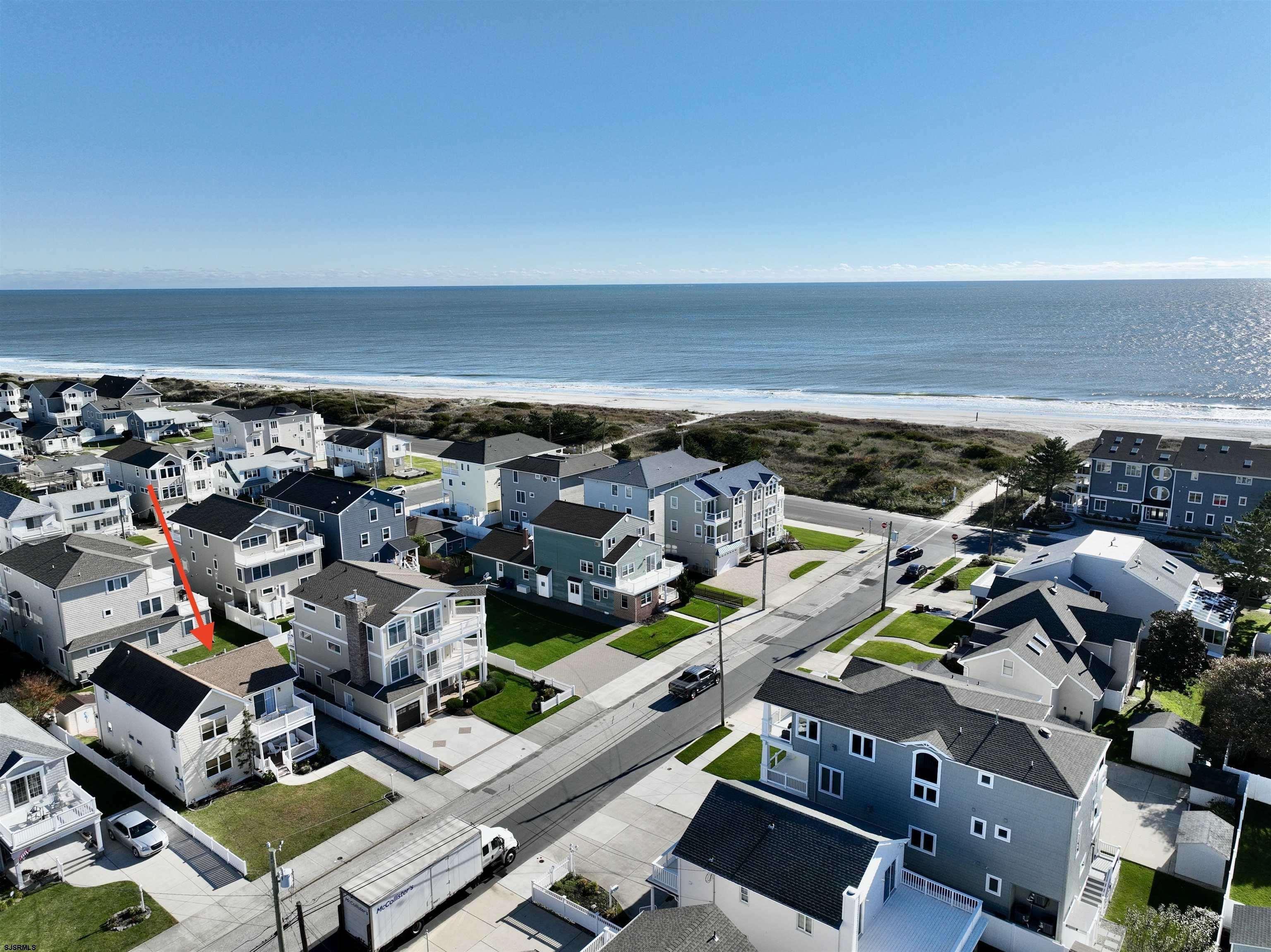 337 12th Street South Brigantine, NJ 08203 - Photo 2 of 36 an aerial view of residential houses with outdoor space