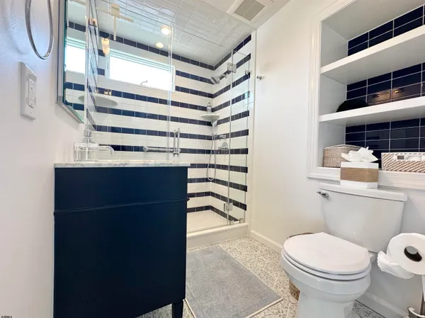 a bathroom with a bathtub and a shower