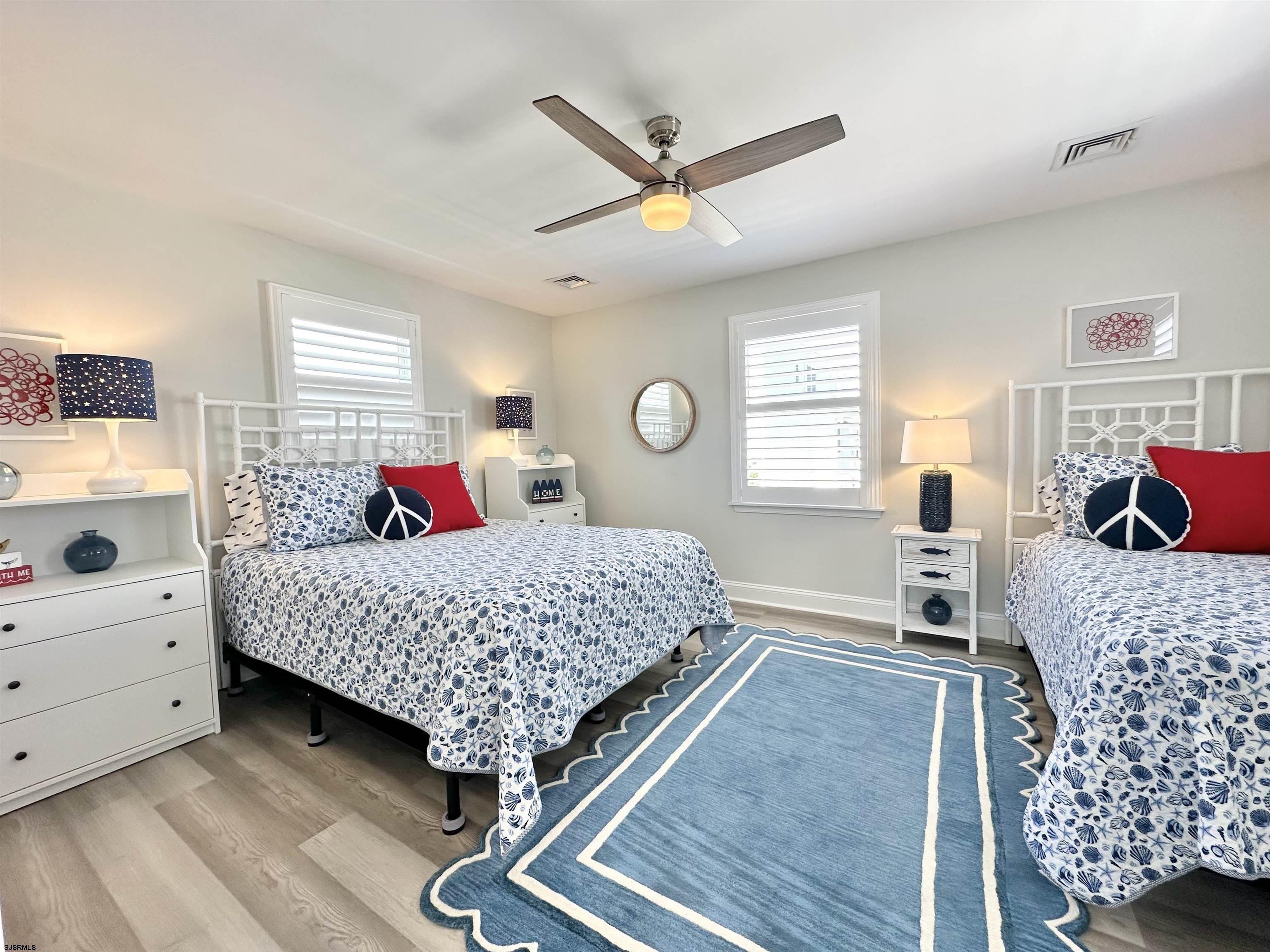 337 12th Street South Brigantine, NJ 08203 - Photo 24 of 36 a bedroom with a bed and window