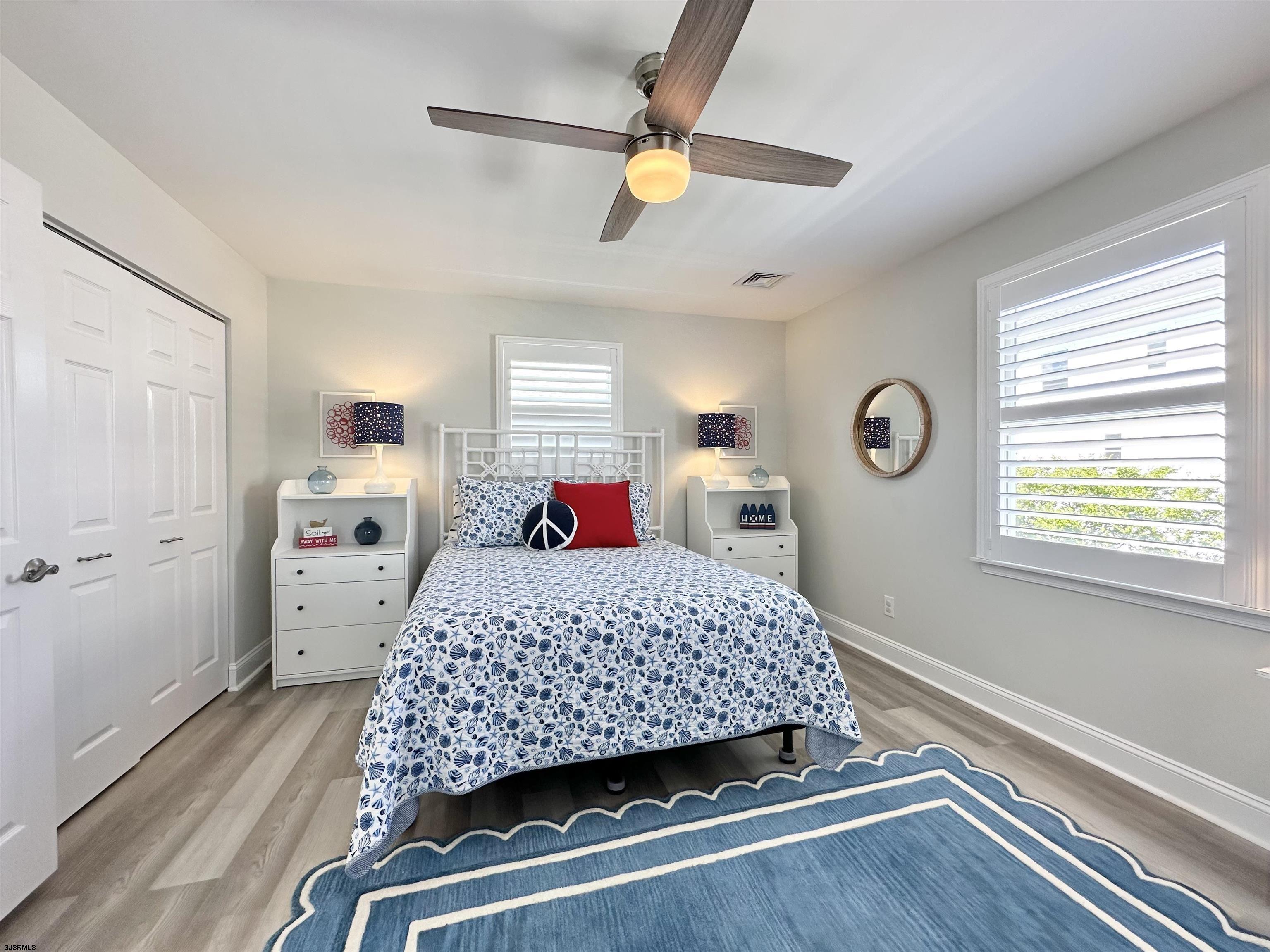 337 12th Street South Brigantine, NJ 08203 - Photo 25 of 36 a room with a bed and a window
