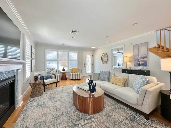 a living room with furniture and a fireplace