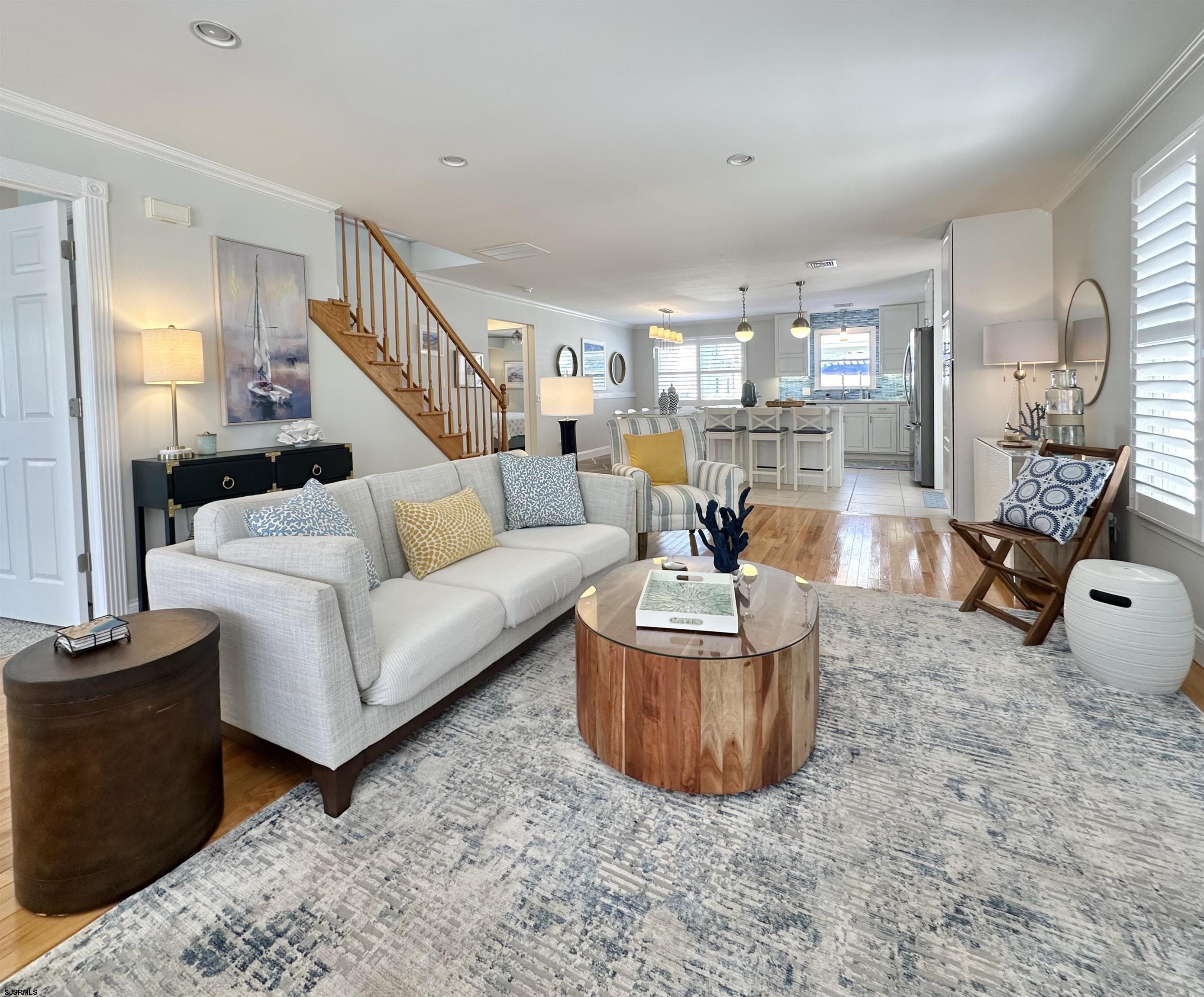 337 12th Street South Brigantine, NJ 08203 - Photo 5 of 36 a living room with furniture a ceiling fan and a rug