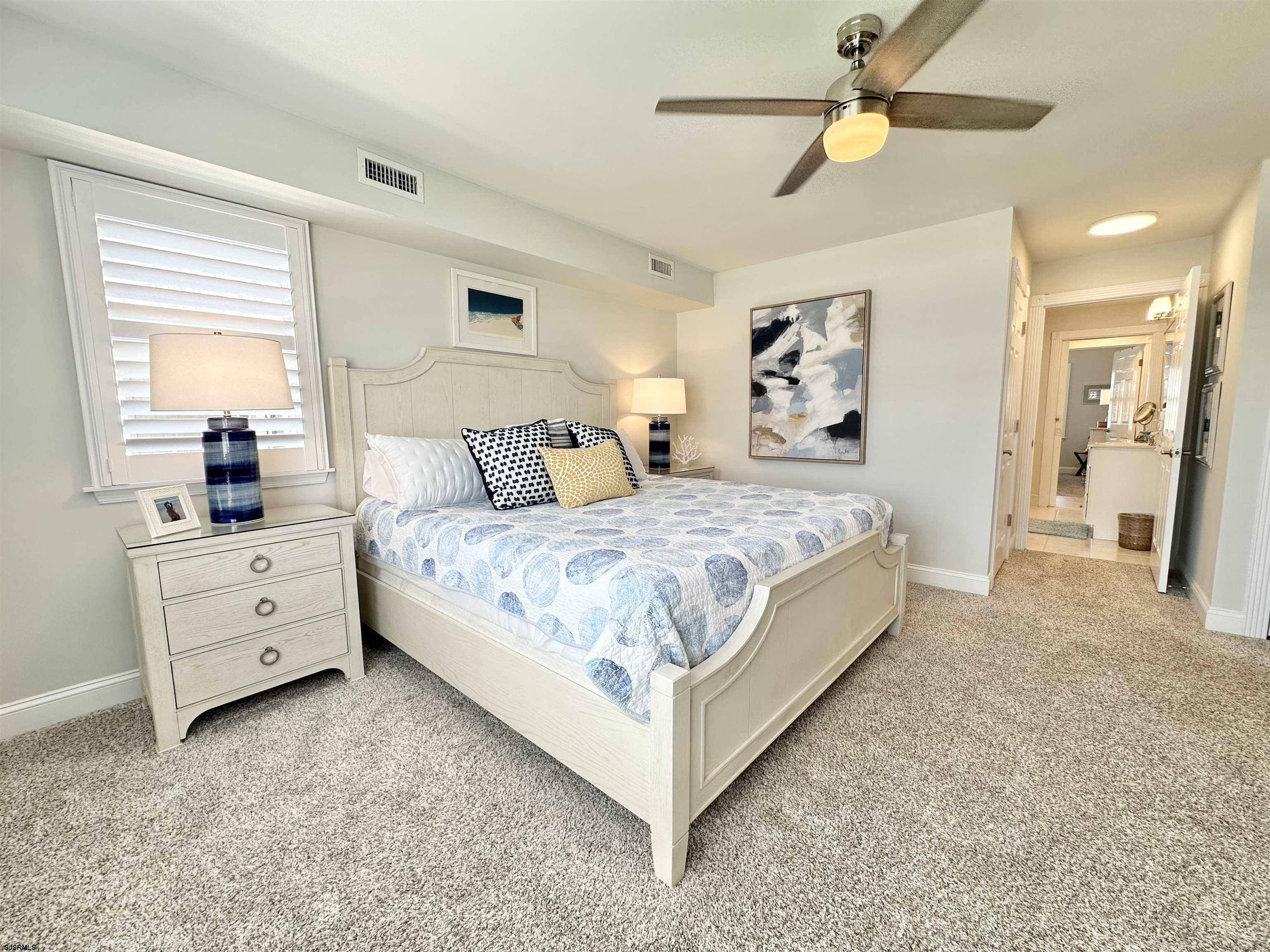 337 12th Street South Brigantine, NJ 08203 - Photo 10 of 36 a bedroom with a large bed and a window