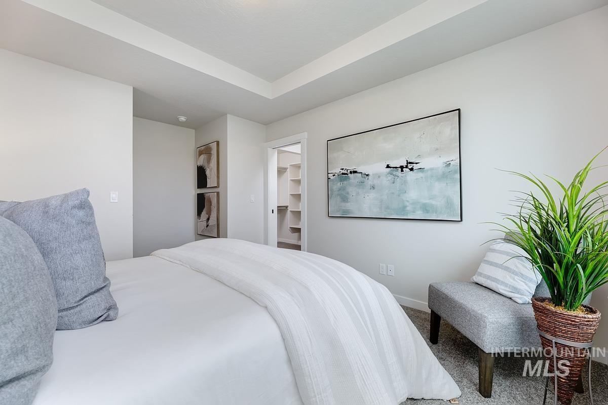 4309 South Zocalo Way Meridian, ID 83642 - Photo 11 of 26 Bedroom with a walk in closet and carpet