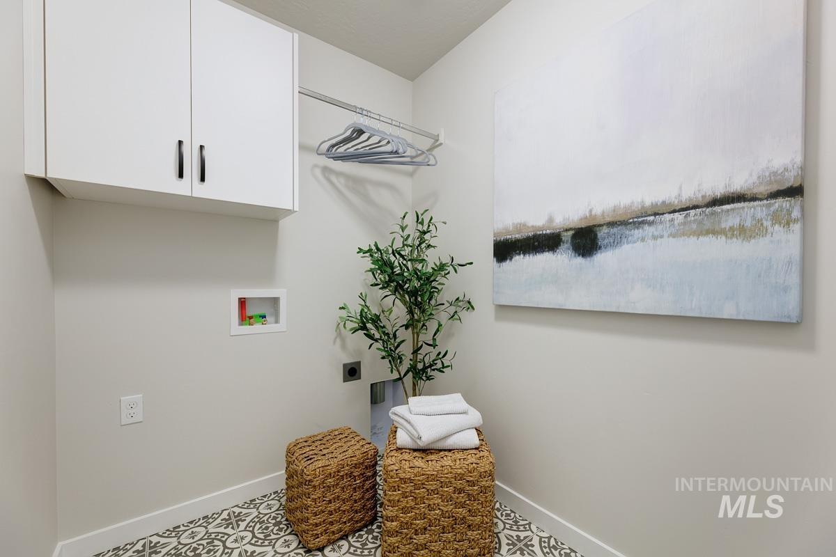 4309 South Zocalo Way Meridian, ID 83642 - Photo 13 of 26 Laundry room featuring hookup for a washing machine and cabinet space
