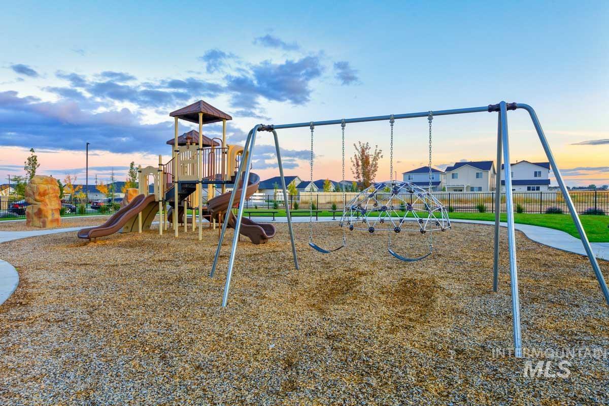 4309 South Zocalo Way Meridian, ID 83642 - Photo 21 of 26 Playground at dusk featuring a residential view
