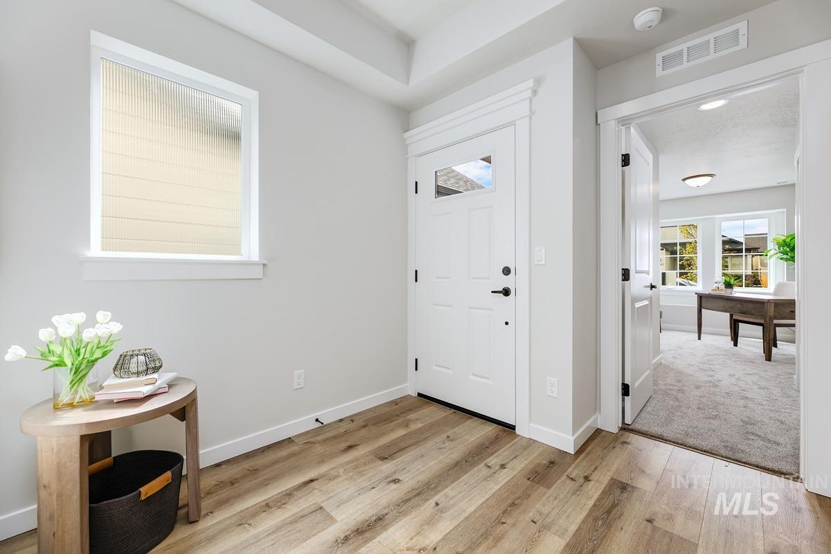4309 South Zocalo Way Meridian, ID 83642 - Photo 3 of 26 Entrance foyer with light wood finished floors and baseboards