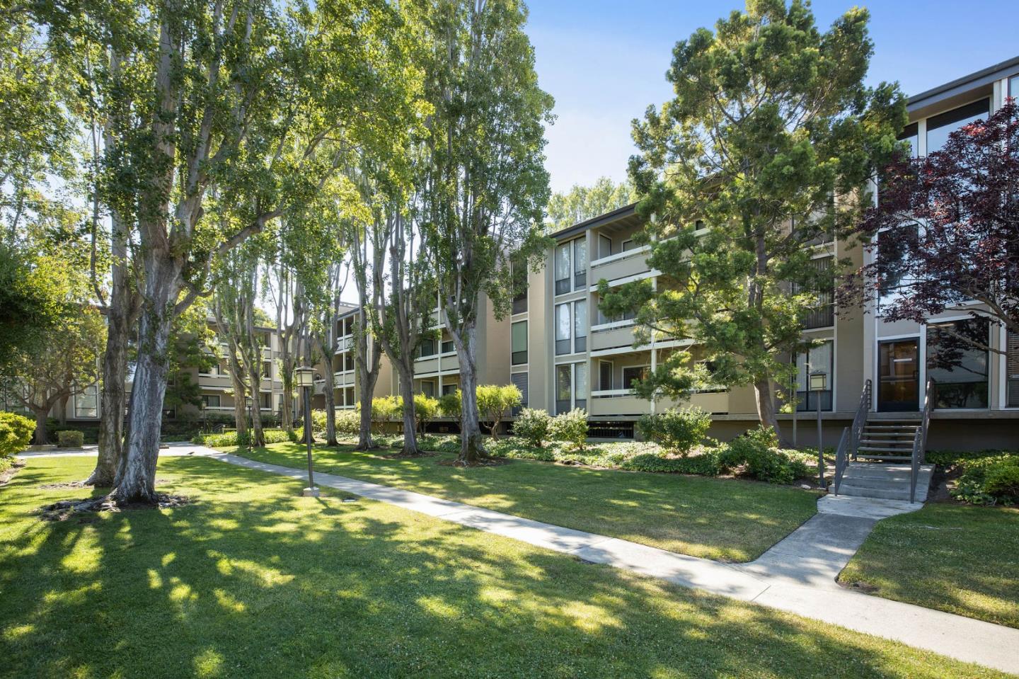 1171 Compass Lane, Unit 216 Foster City, CA 94404 - Photo 2 of 35 a view of a building with a yard