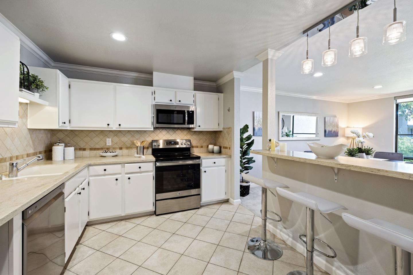 1171 Compass Lane, Unit 216 Foster City, CA 94404 - Photo 16 of 35 a kitchen with cabinets stainless steel appliances and a sink