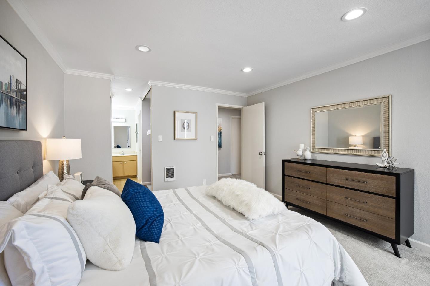 1171 Compass Lane, Unit 216 Foster City, CA 94404 - Photo 21 of 35 a bedroom with a bed and a painting on the wall