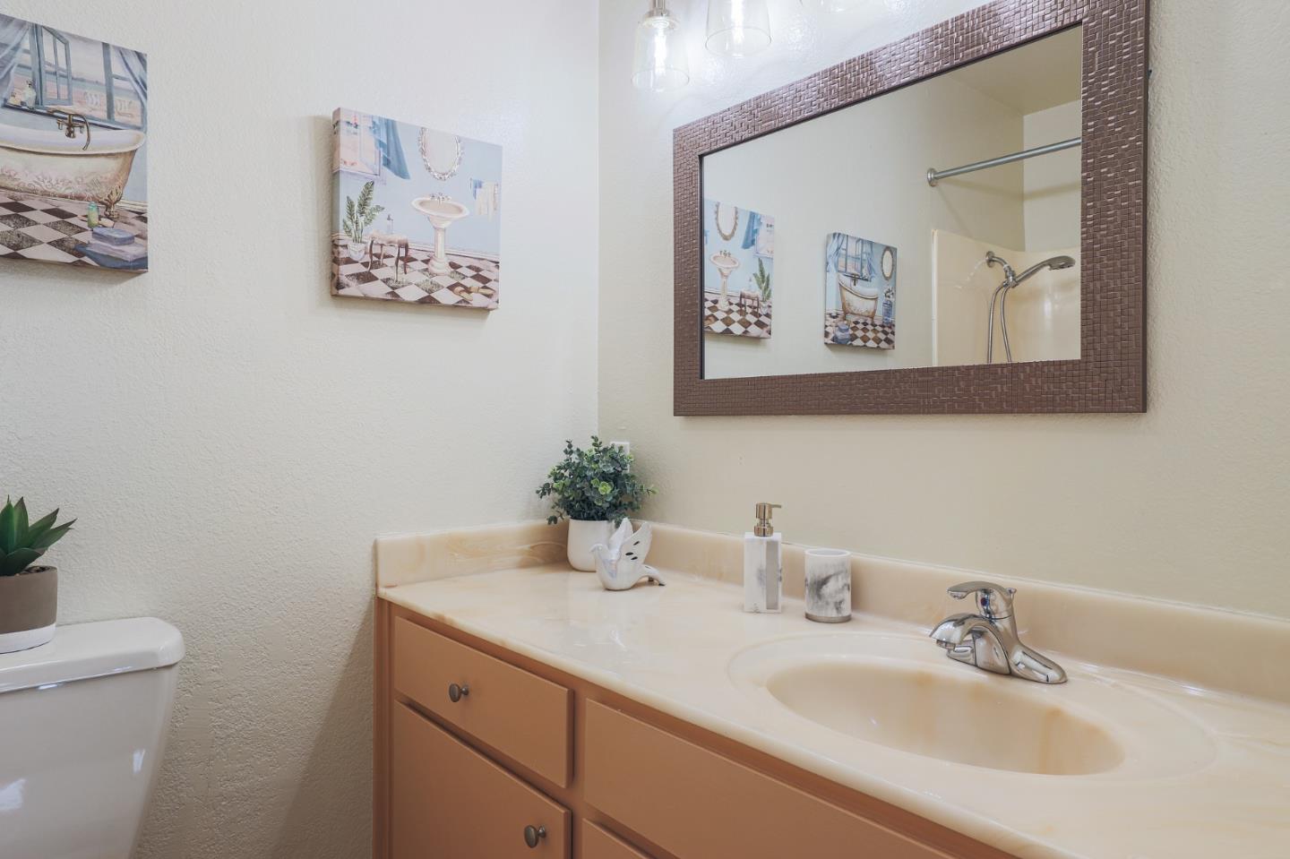 1171 Compass Lane, Unit 216 Foster City, CA 94404 - Photo 26 of 35 a bathroom with a sink mirror and vanity