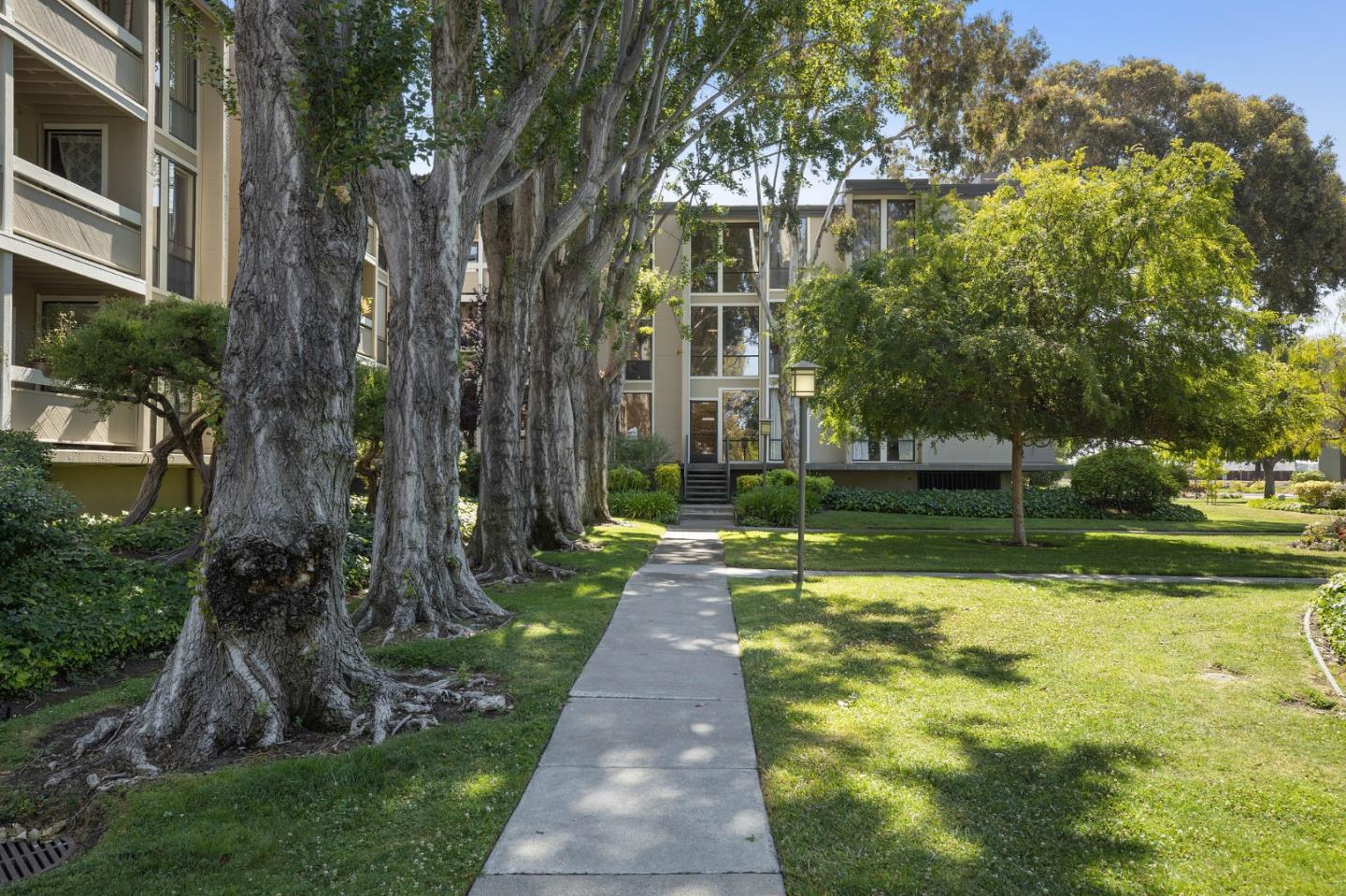 1171 Compass Lane, Unit 216 Foster City, CA 94404 - Photo 32 of 35 a view of a fountain in front of a house with a big yard