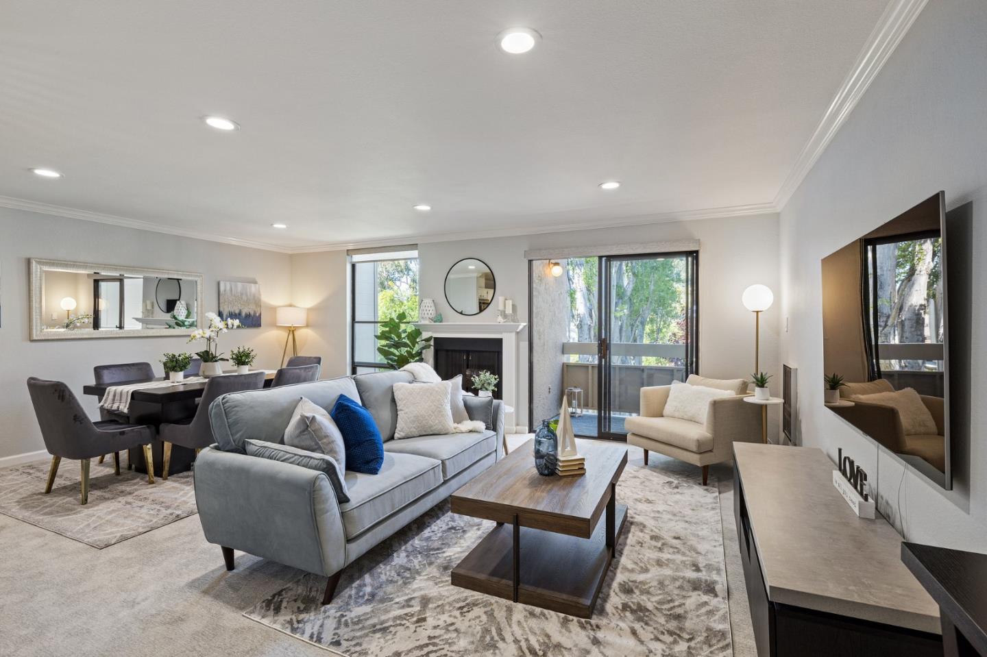 1171 Compass Lane, Unit 216 Foster City, CA 94404 - Photo 5 of 35 a living room with furniture fireplace and large windows