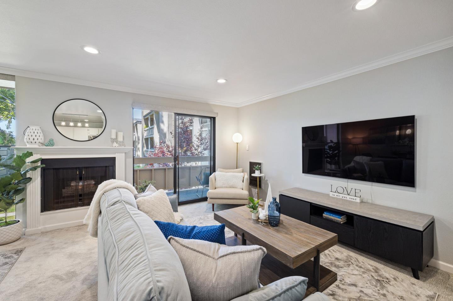 1171 Compass Lane, Unit 216 Foster City, CA 94404 - Photo 6 of 35 a living room with furniture and a flat screen tv