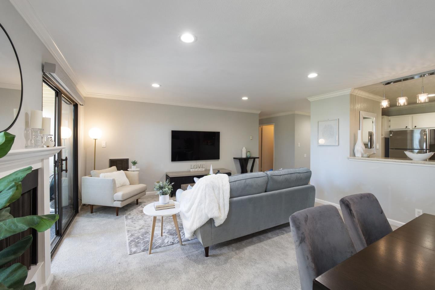 1171 Compass Lane, Unit 216 Foster City, CA 94404 - Photo 8 of 35 a living room with furniture and a flat screen tv