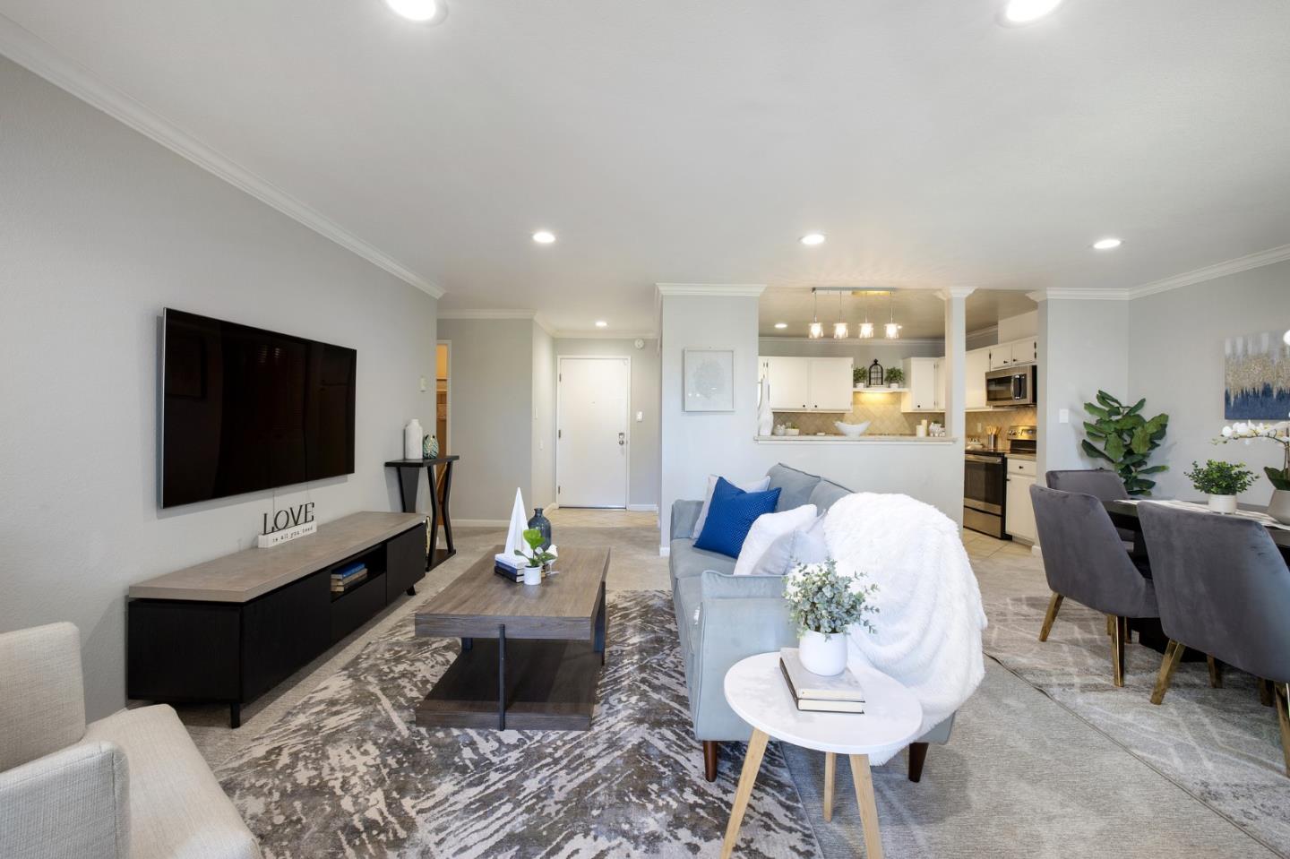 1171 Compass Lane, Unit 216 Foster City, CA 94404 - Photo 9 of 35 a living room with furniture and a flat screen tv