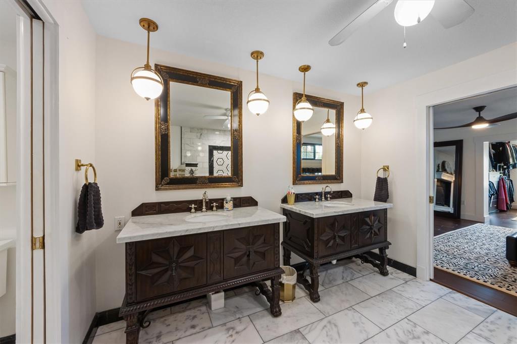 505 75th Street Holmes Beach, FL 34217 - Photo 40 of 75 a bathroom with a sink double vanity and a mirror