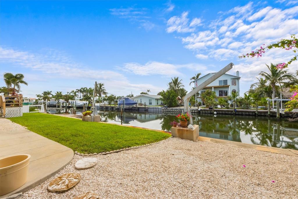 505 75th Street Holmes Beach, FL 34217 - Photo 52 of 75 a view of a lake with a house