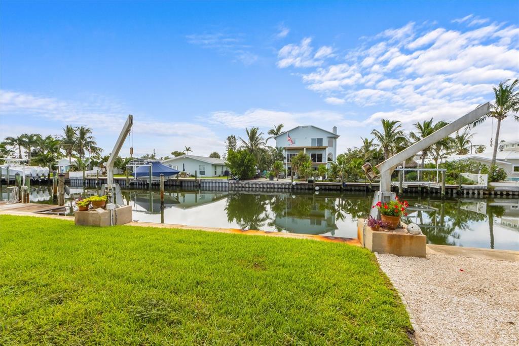 505 75th Street Holmes Beach, FL 34217 - Photo 54 of 75 a view of a lake with houses