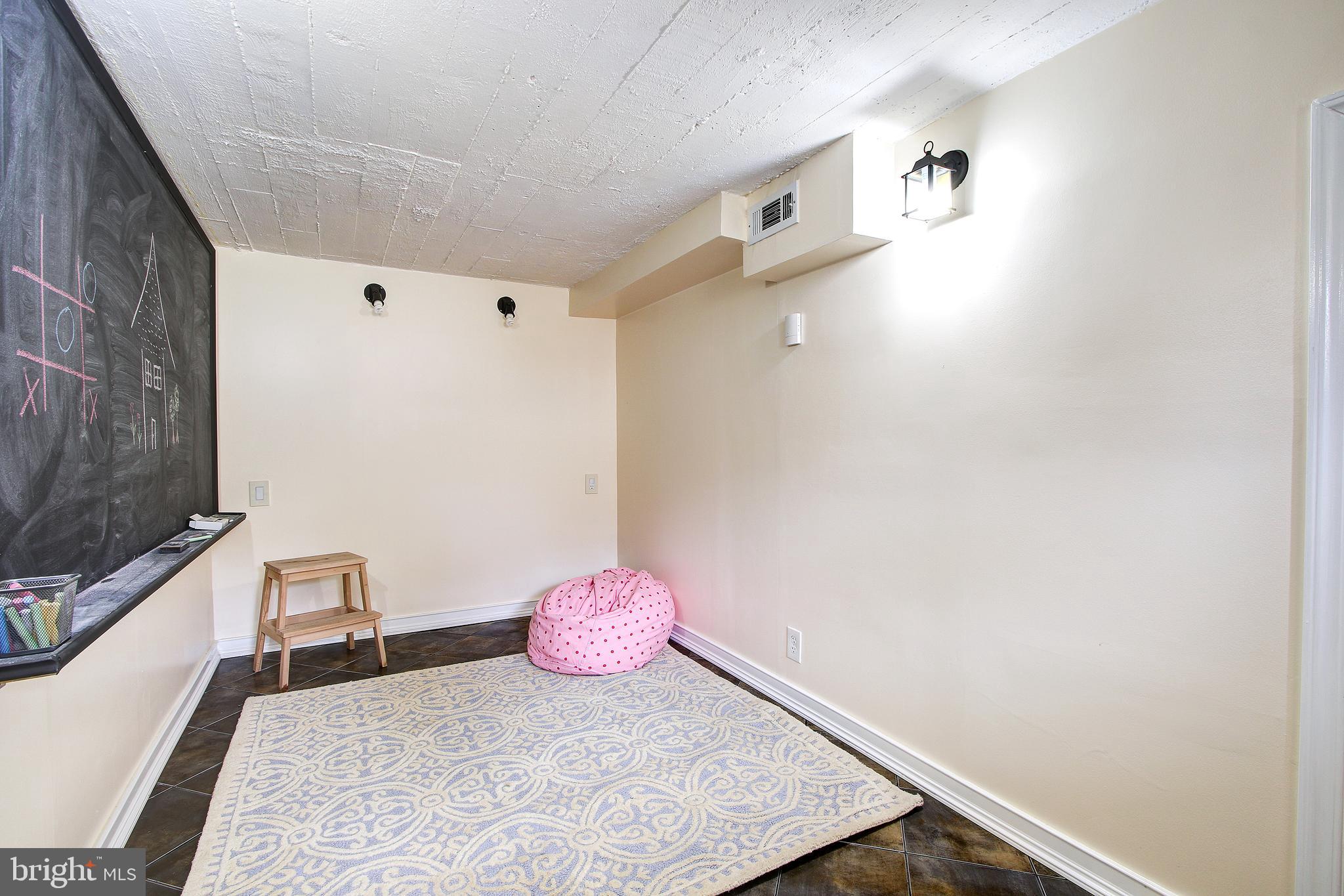 315 Penwood Road Silver Spring, MD 20901 - Photo 34 of 41 Lower level playroom/hobby space