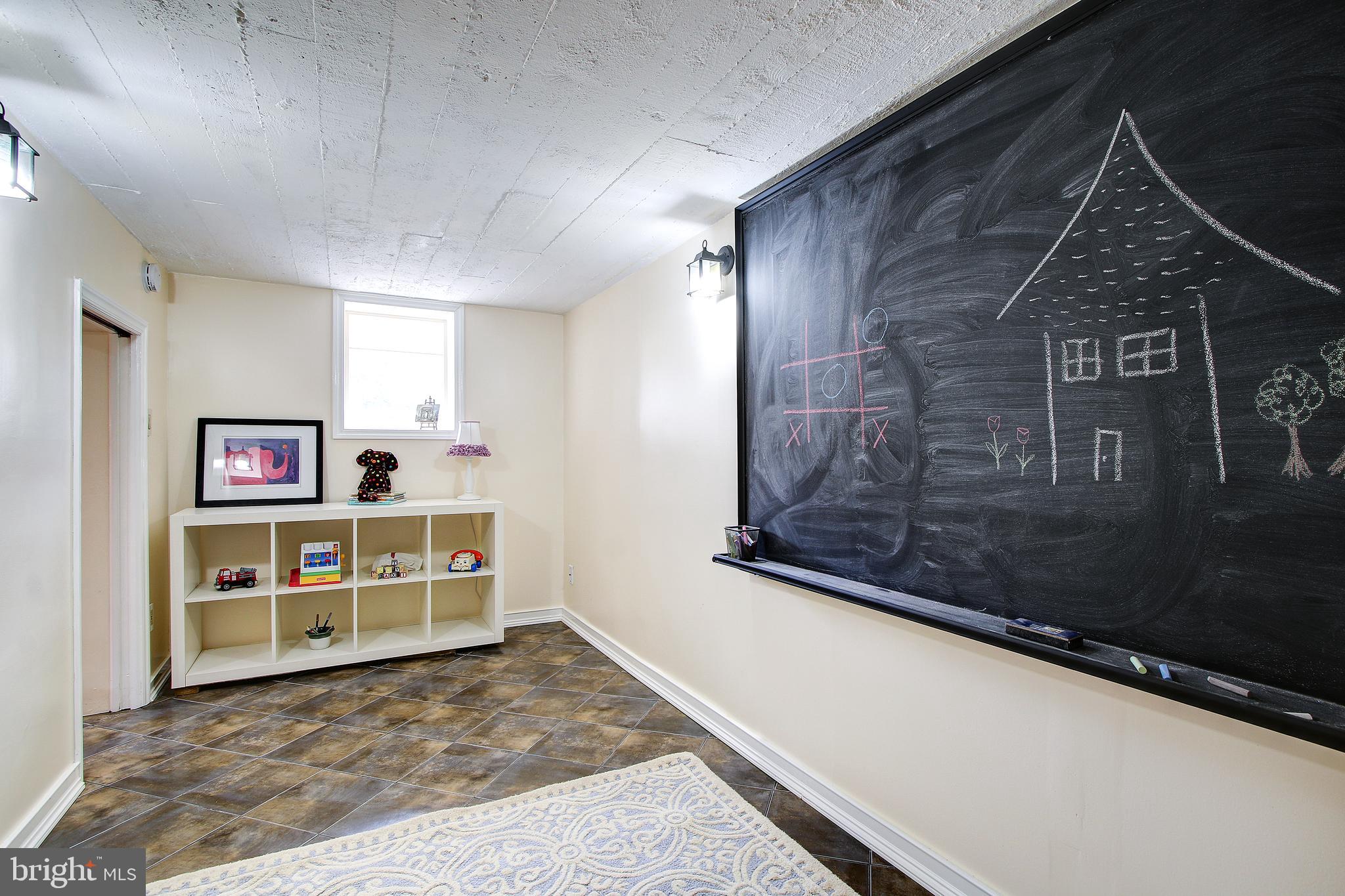 315 Penwood Road Silver Spring, MD 20901 - Photo 35 of 41 Lower level playroom/hobby space