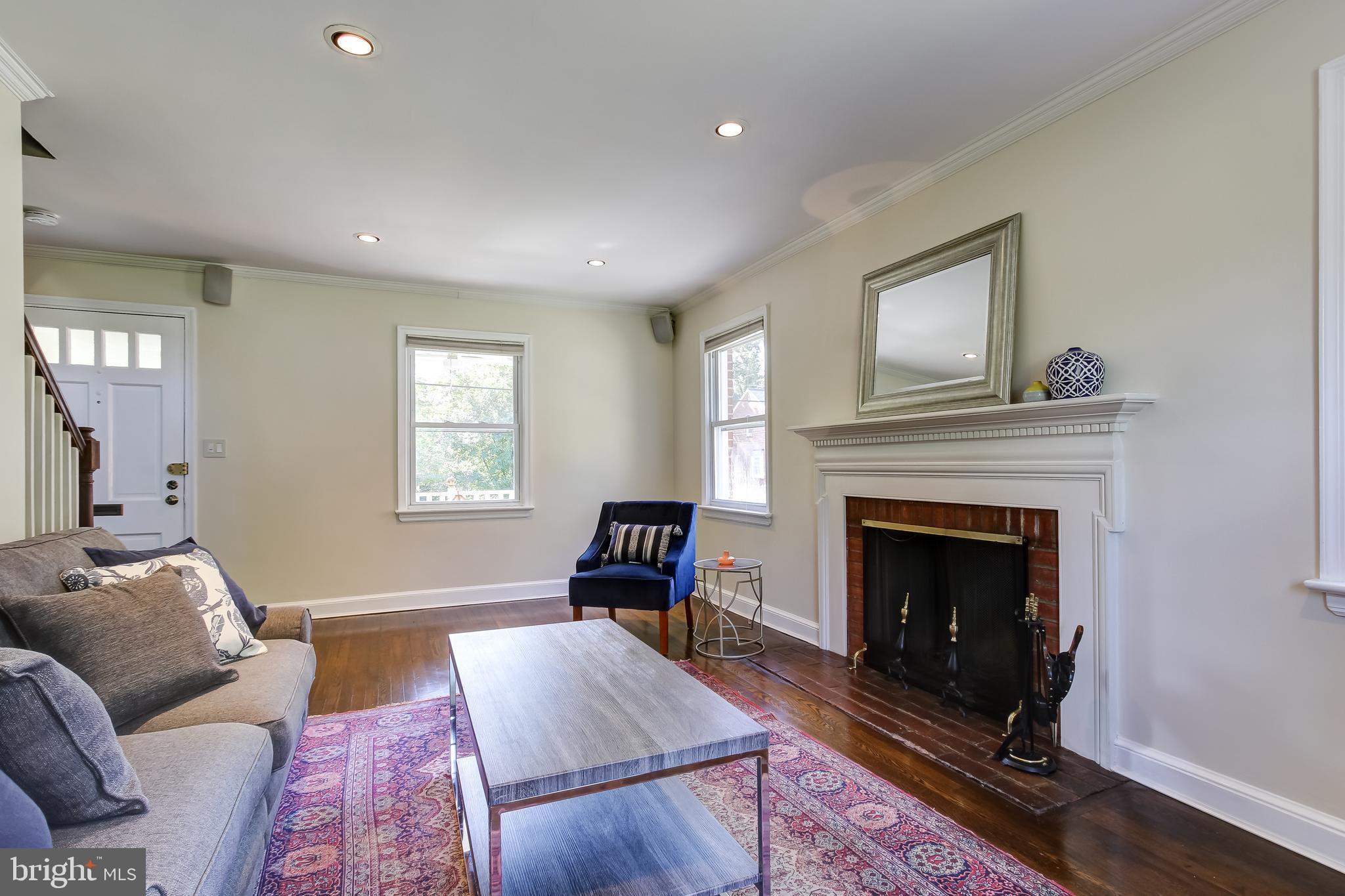 315 Penwood Road Silver Spring, MD 20901 - Photo 9 of 41 Living room with wood burning fireplace