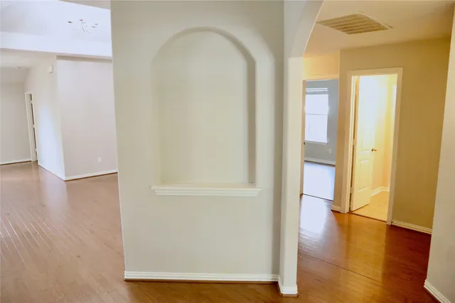an entryway with wooden floor